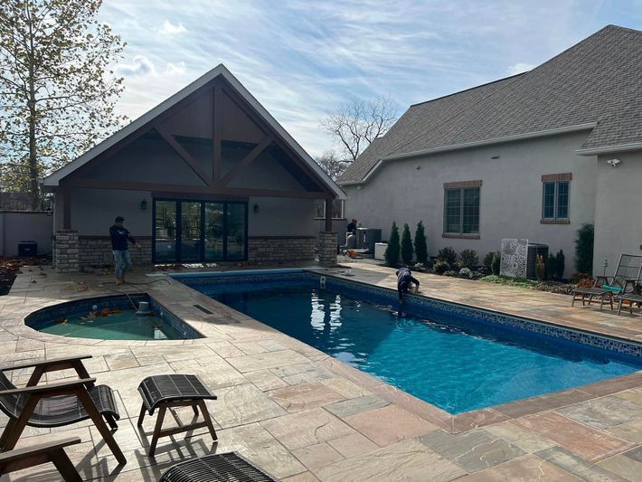 Workers Cleaning The Pool - Delaware, OH - Outdoor Living Pools & Patio