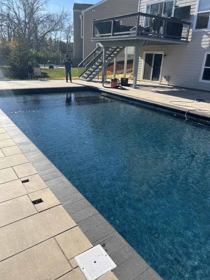 Man Standing Near The Pool - Delaware, OH - Outdoor Living Pools & Patio