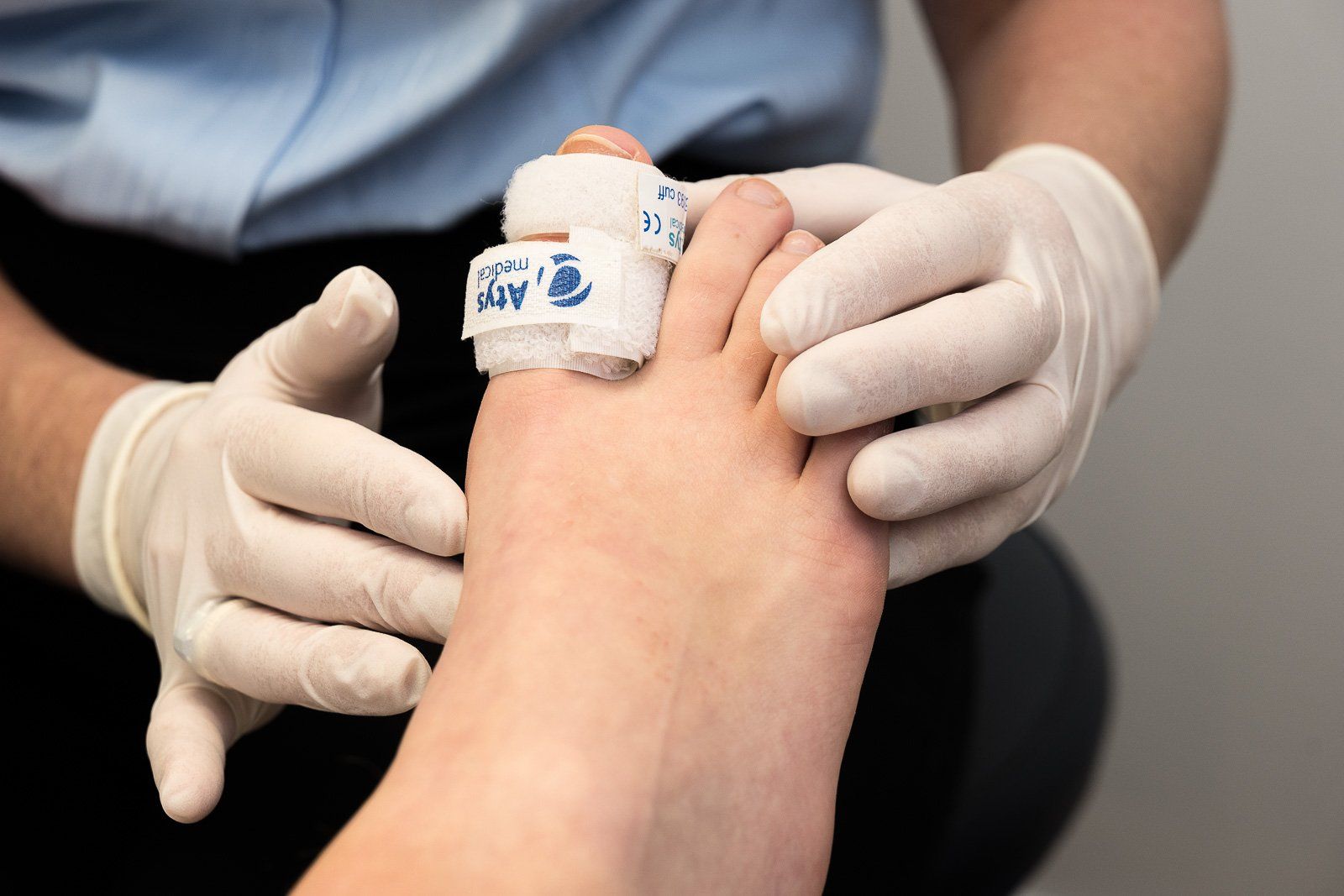 Doctor holding a foot