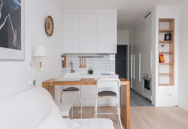 white kitchen with grey barstools