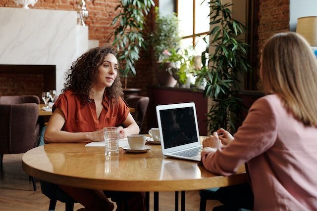 business professional sitting in chair reviewing documents