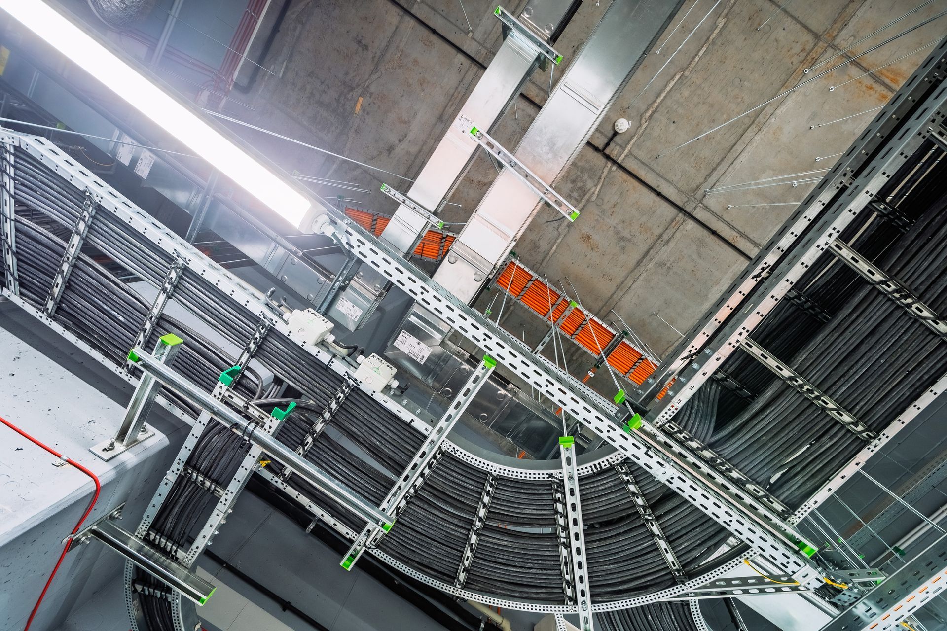Close-up of an intricate network of industrial electrical installations and power cables. Close-up of an intricate network of industrial electrical installations and power cables.