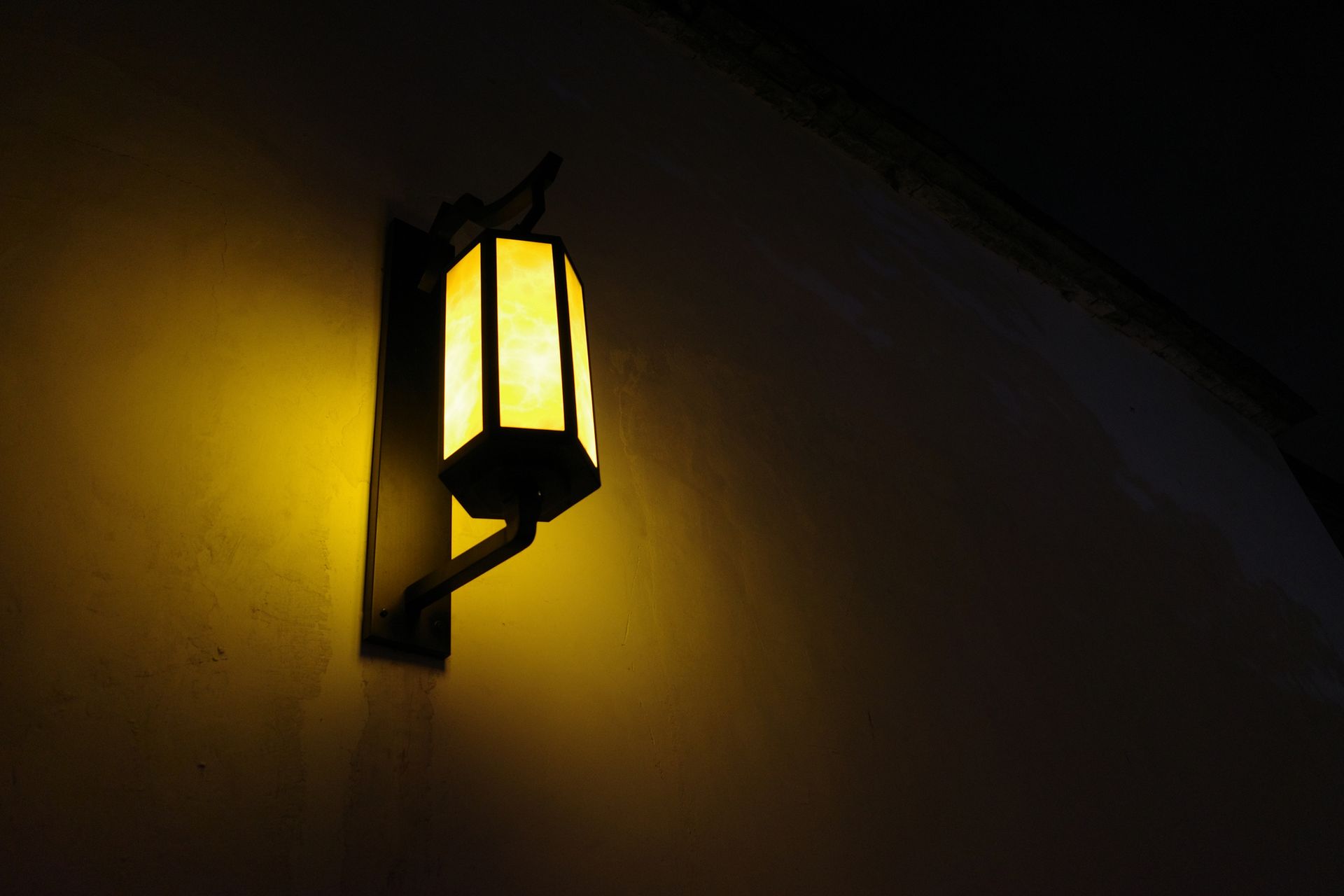 Outdoor wall lamp showcasing elegant illumination for night exterior spaces.