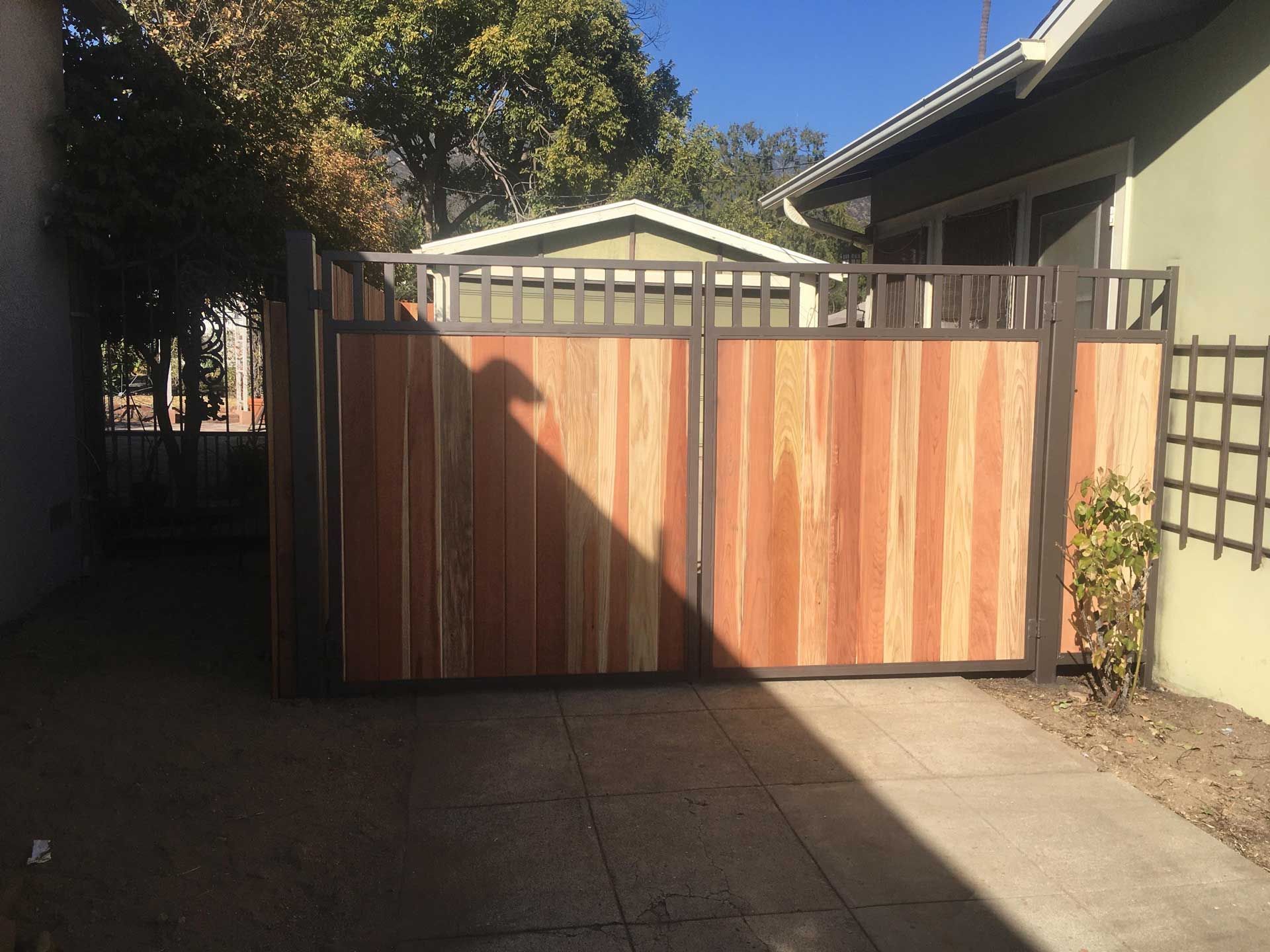 Metal And Wood Bi-folding Gate – Los Angeles, CA – Reyes Fencing