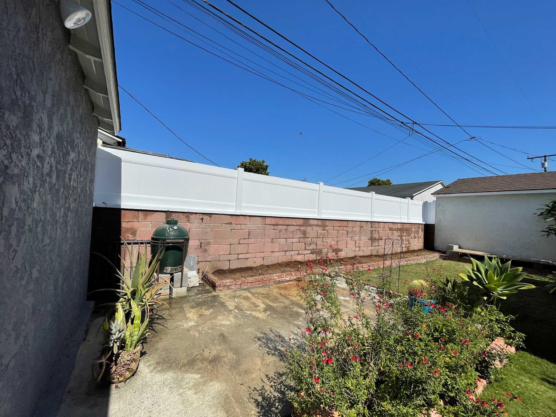 Vinyl Fence Over Brick Wall – Los Angeles, CA – Reyes Fencing
