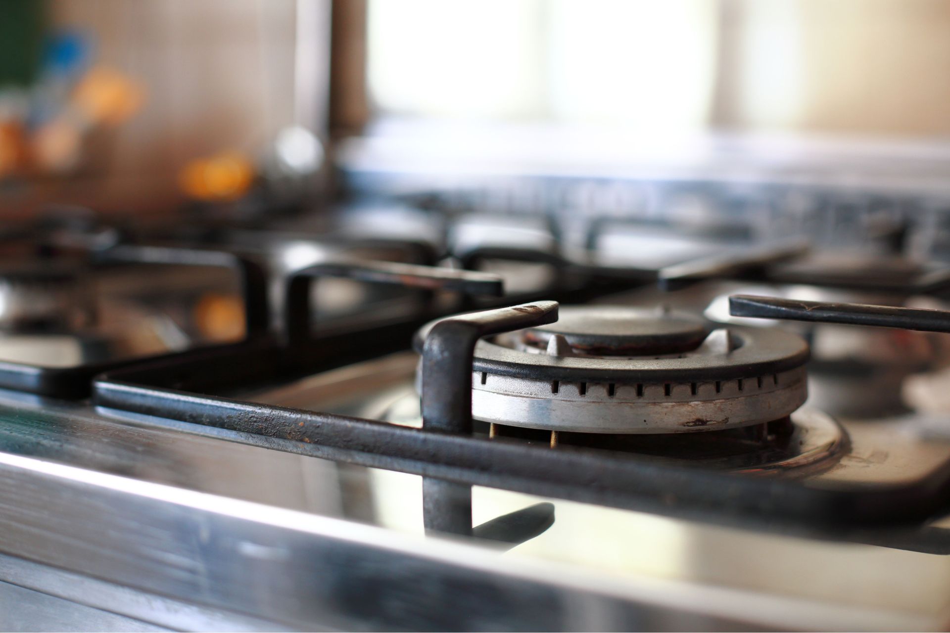 A close up of a gas stove burner in a kitchen.