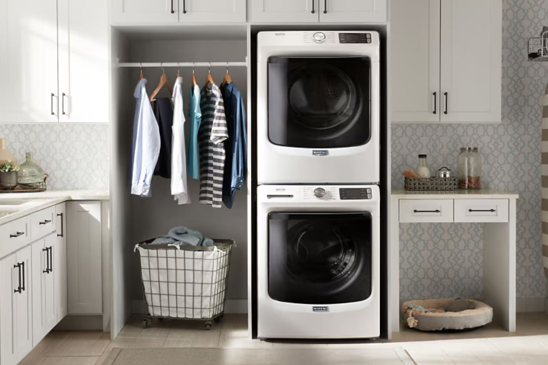 A laundry room with a washer and dryer stacked on top of each other.