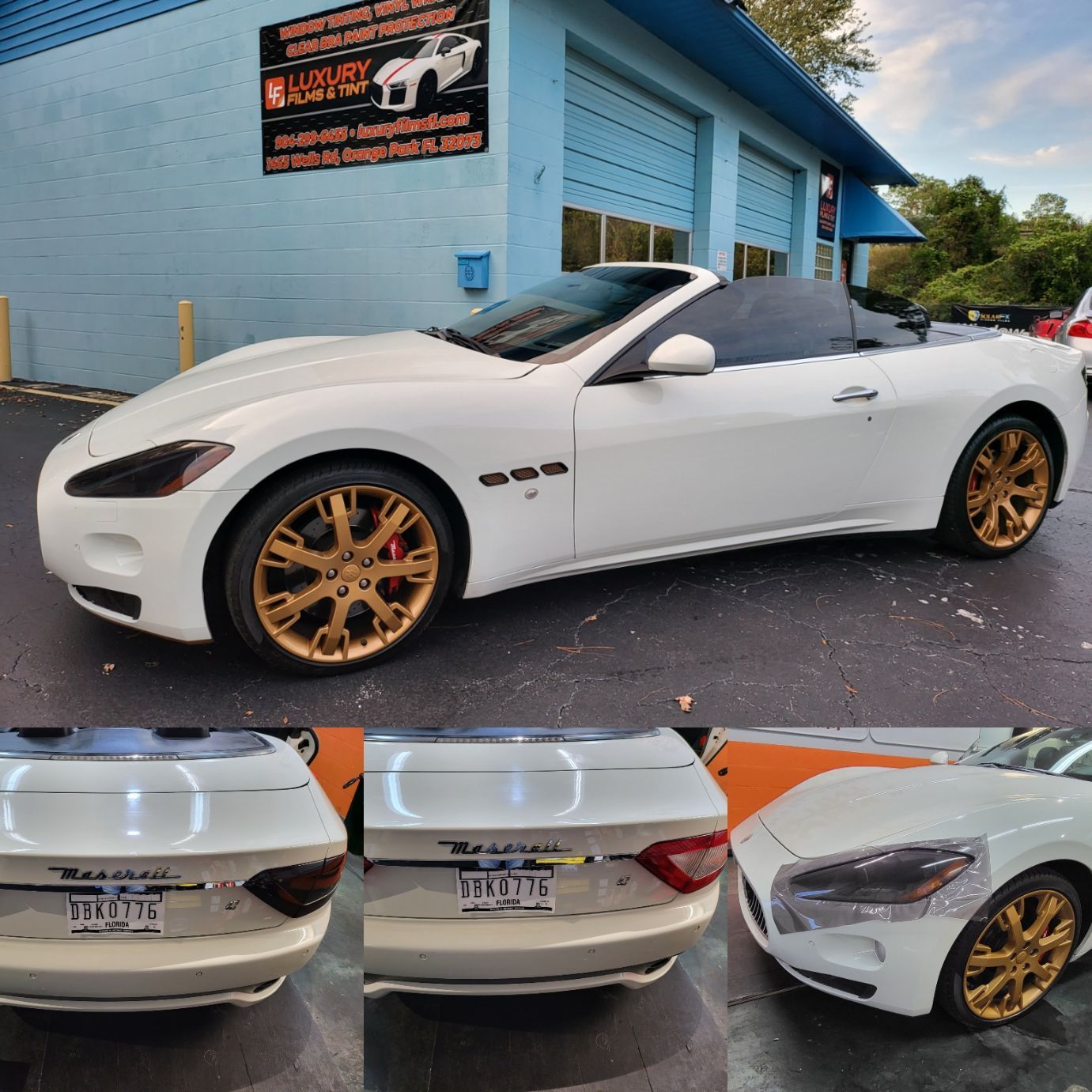 A white sports car is parked in front of a garage