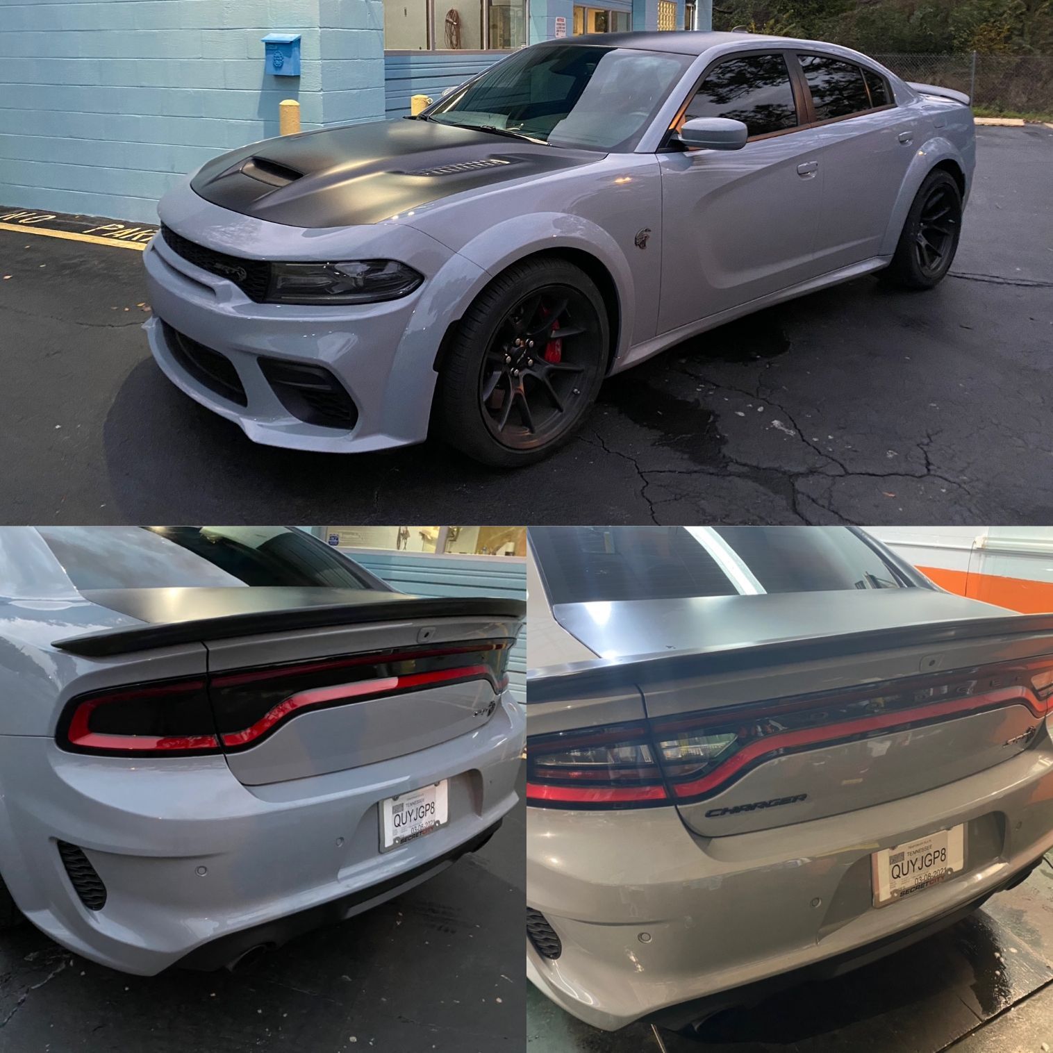 A gray dodge charger is parked in a parking lot.