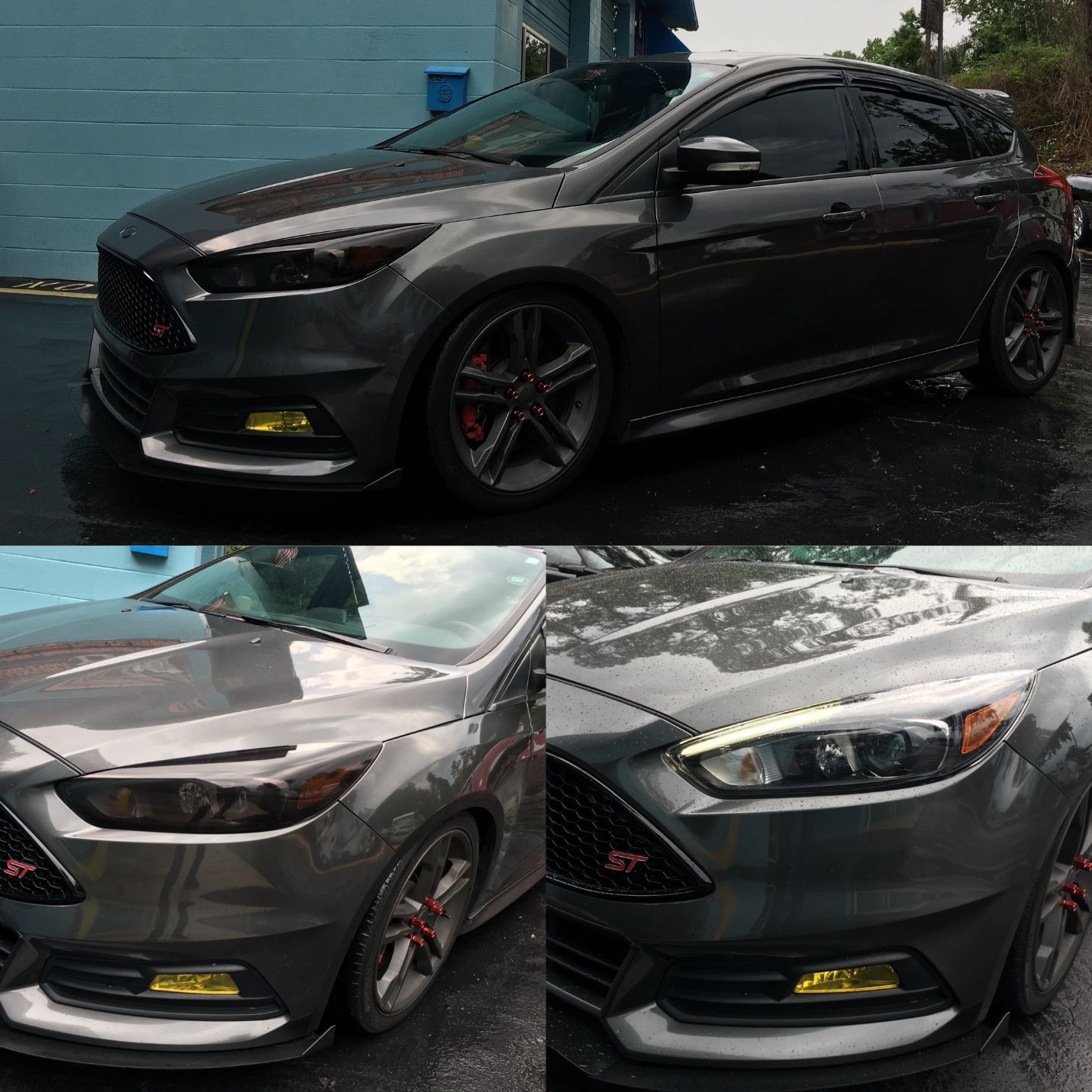 A gray ford focus is parked in front of a blue building
