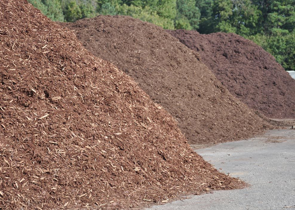 A pile of brown mulch is stacked on top of each other