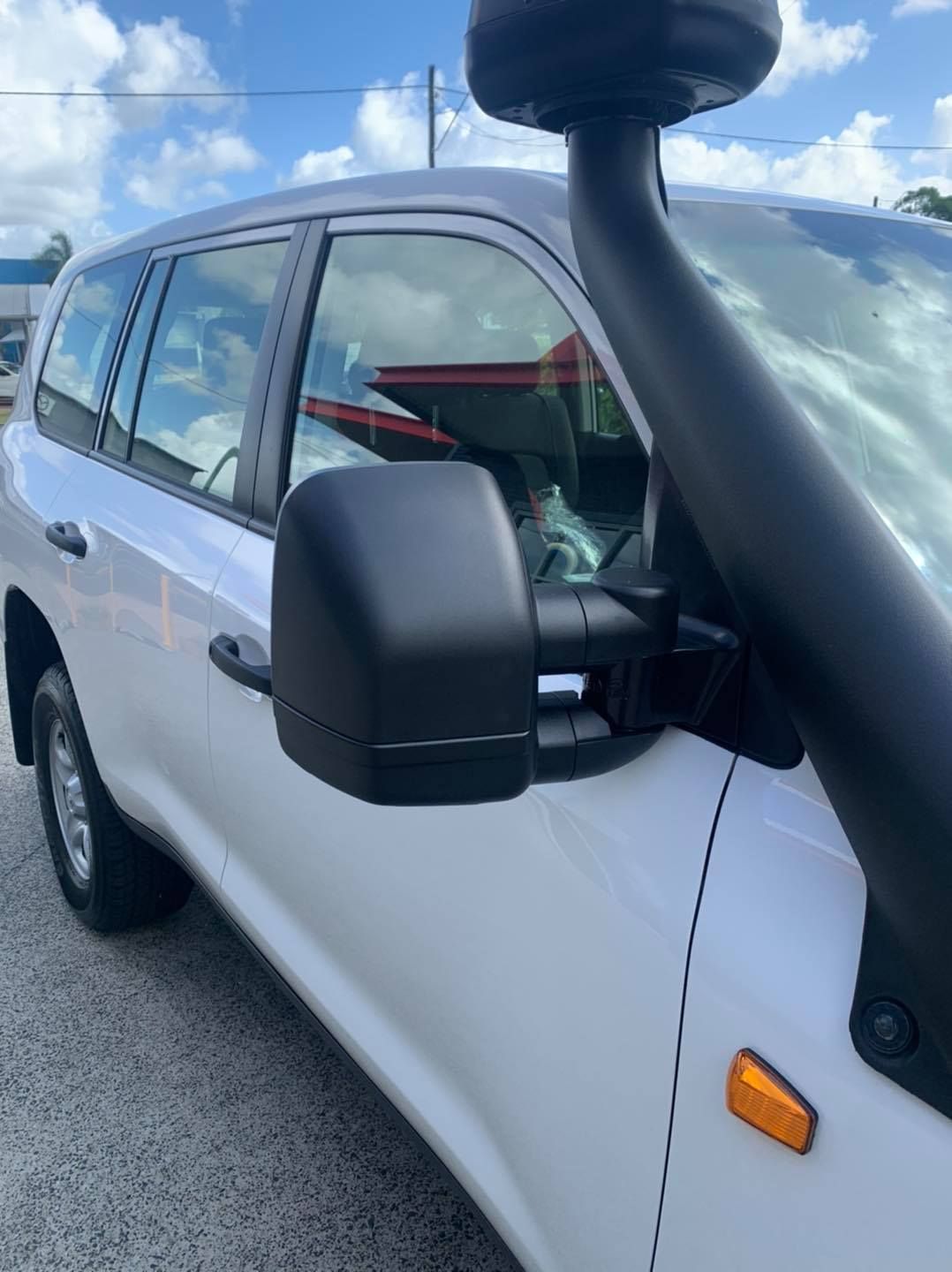 A White SUV With A Black Snorkel Is Parked In A Parking Lot — Tech Tune Automotive and 4x4 ARB In Innisfail, QLD