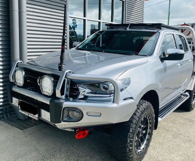 A Silver Pickup Truck Is Parked In Front Of A Building — Tech Tune Automotive and 4x4 ARB In Innisfail, QLD