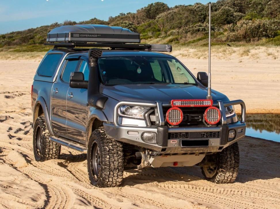 A Ford Ranger Is Parked On A Sandy Beach Next To A Body Of Water — Tech Tune Automotive and 4x4 ARB In Innisfail, QLD