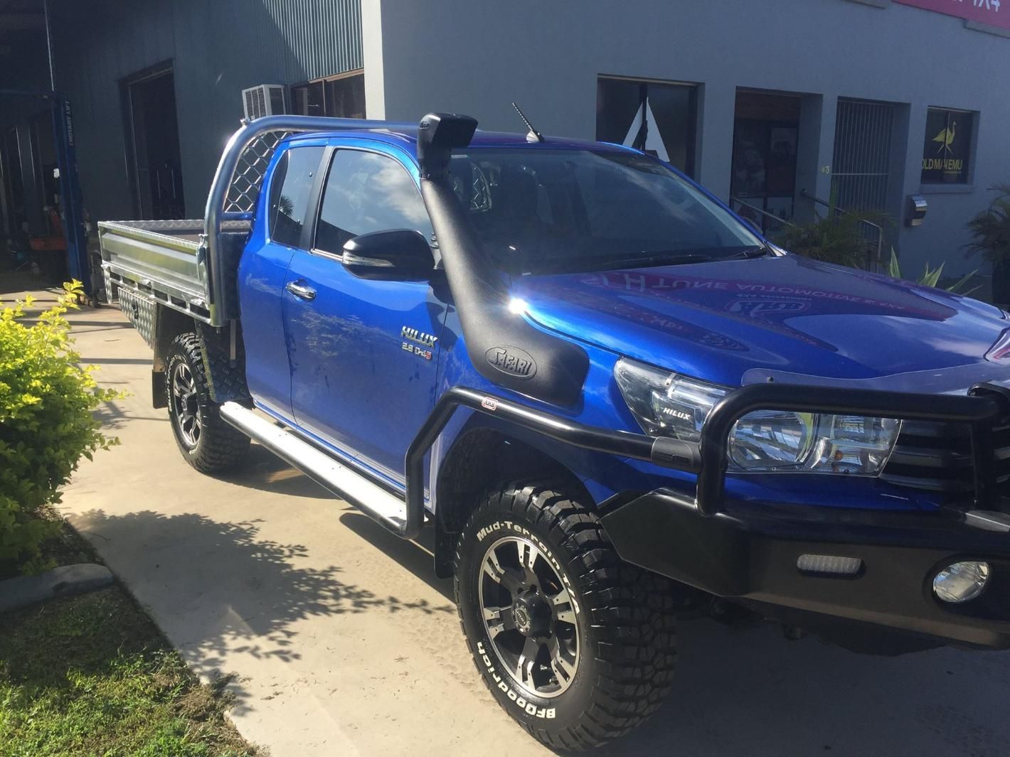 A Blue Truck With A Snorkel Is Parked In Front Of A Building — Tech Tune Automotive and 4x4 ARB In Innisfail, QLD