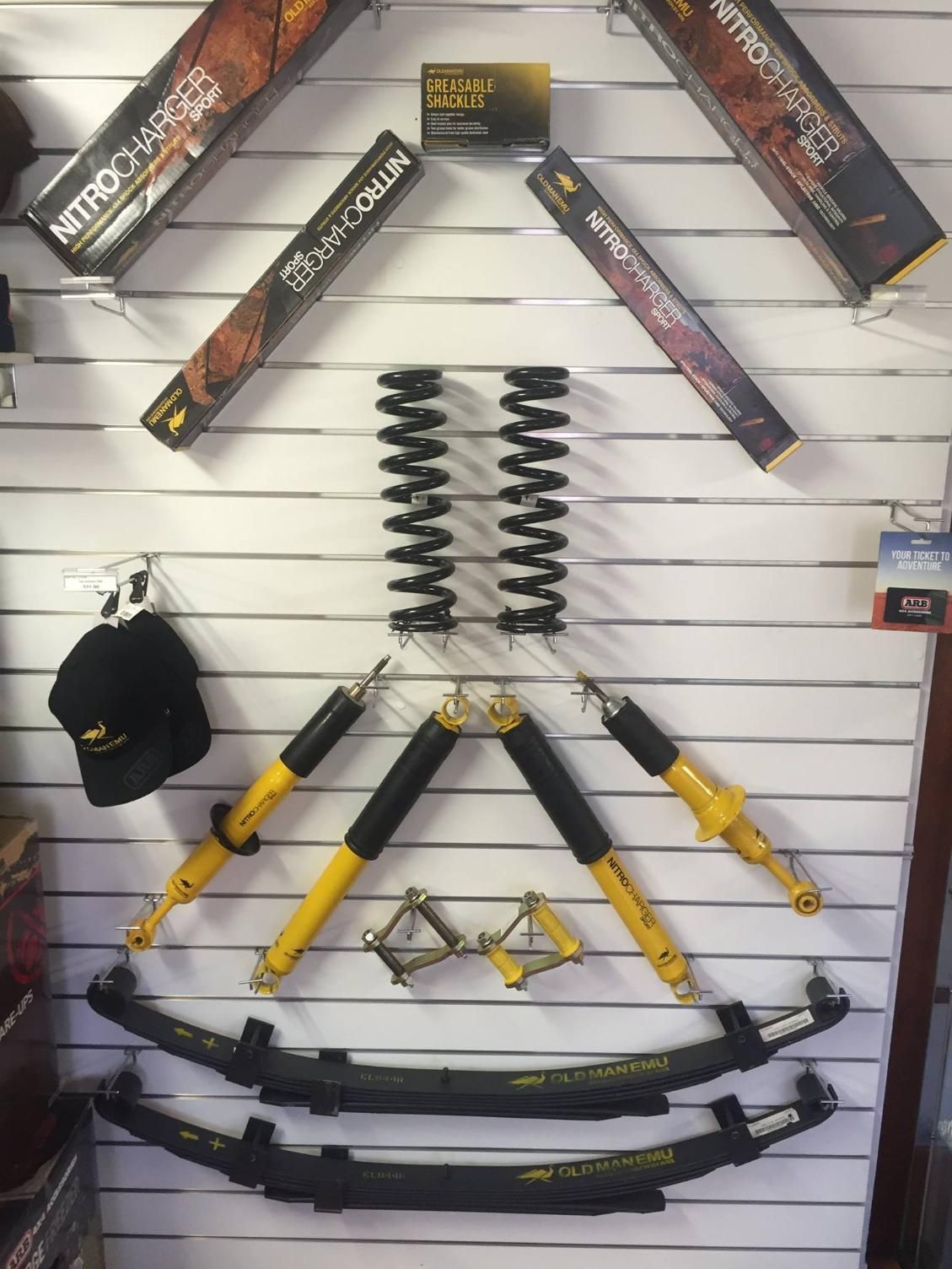 A Bunch Of Suspension Parts Are Hanging On A Wall — Tech Tune Automotive and 4x4 ARB In Innisfail, QLD