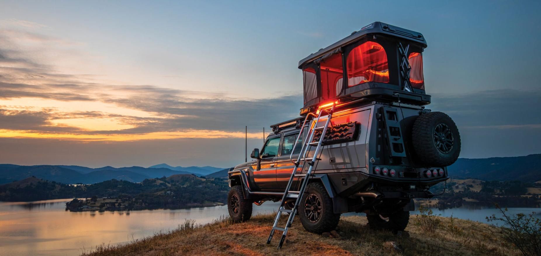 A Jeep With A Tent On Top Of It Is Parked On Top Of A Hill — Tech Tune Automotive and 4x4 ARB In Cardwell, QLD