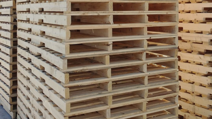 A pile of wooden pallets stacked on top of each other