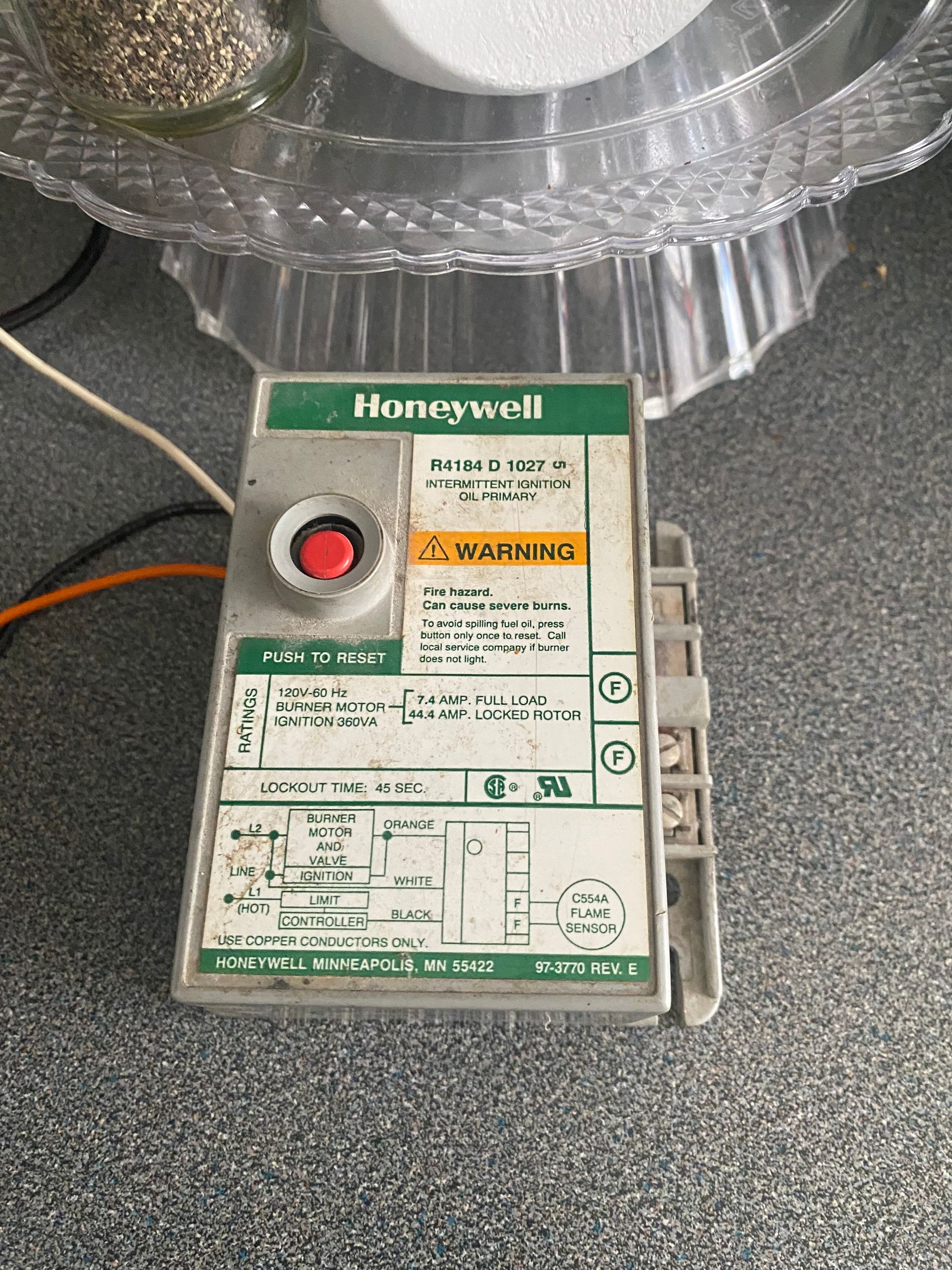 Honeywell gas valve control box with a red reset button.