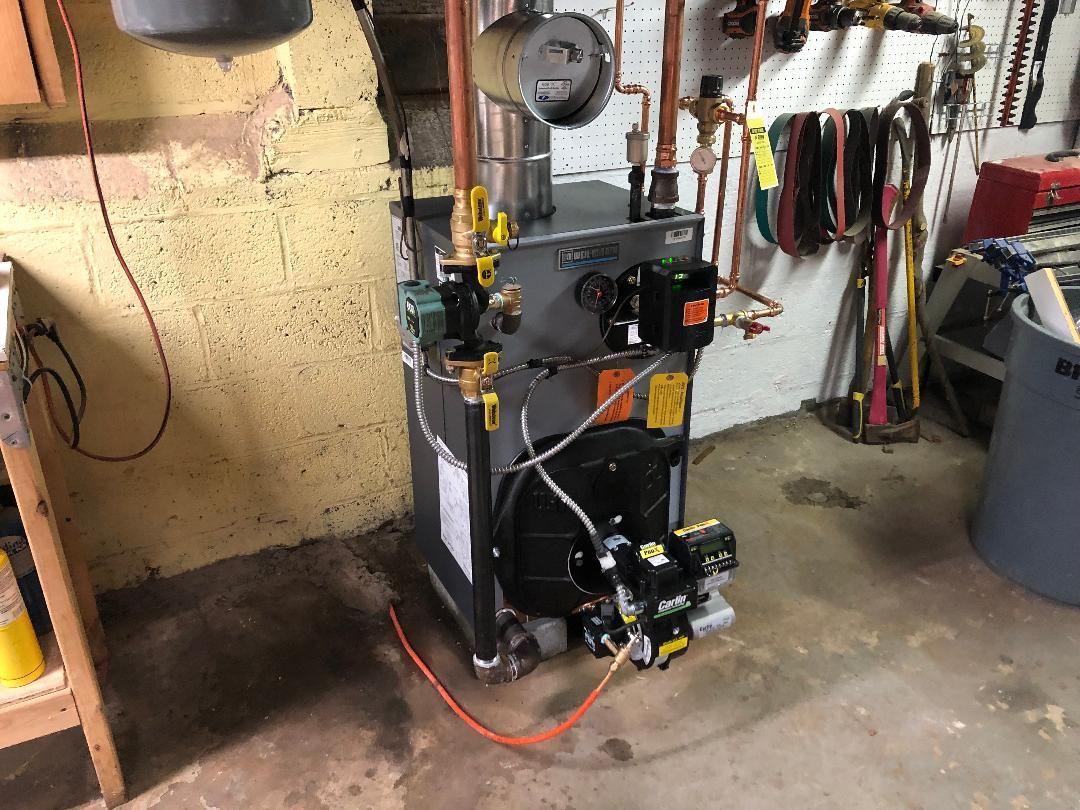 Oil burner furnace in a basement.