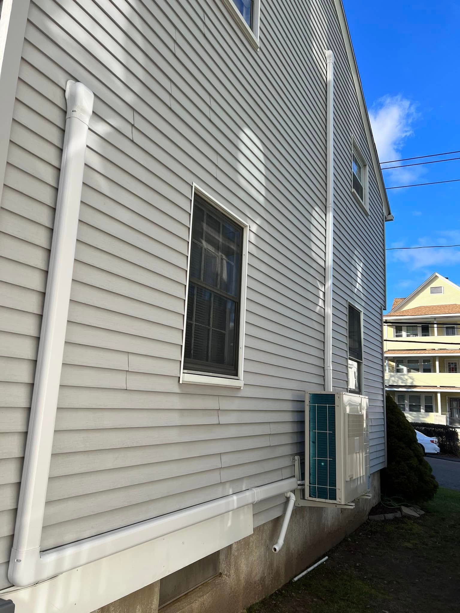 A house with white siding and a blue door