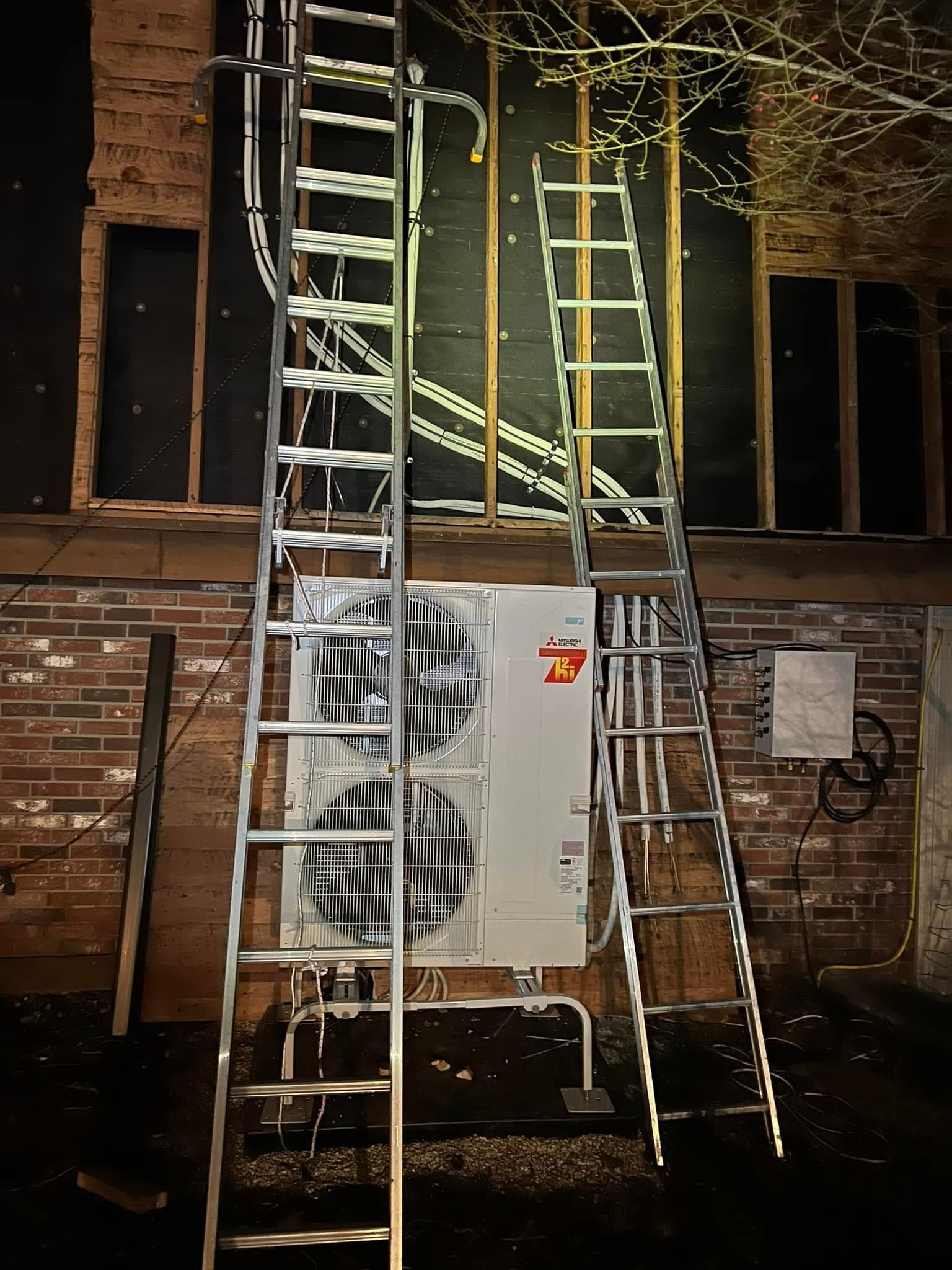 A ladder is leaning against a brick wall next to an air conditioner