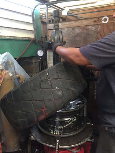 Mechanic Removing Tire from Rim | Wahiawa, HI | Wahiawa Tire Services