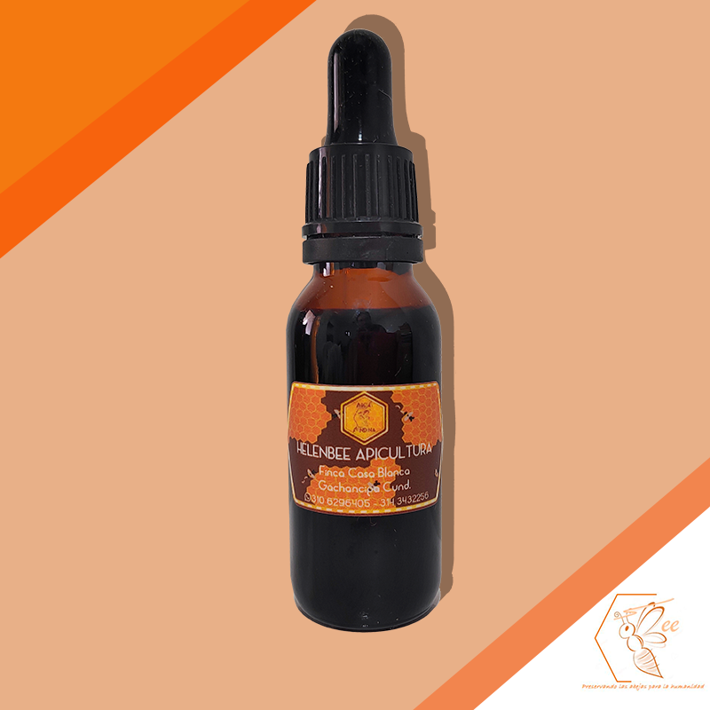 Frasco ámbar con gotero, etiqueta del producto en naranja y marrón. Sobre fondo naranja y beige.