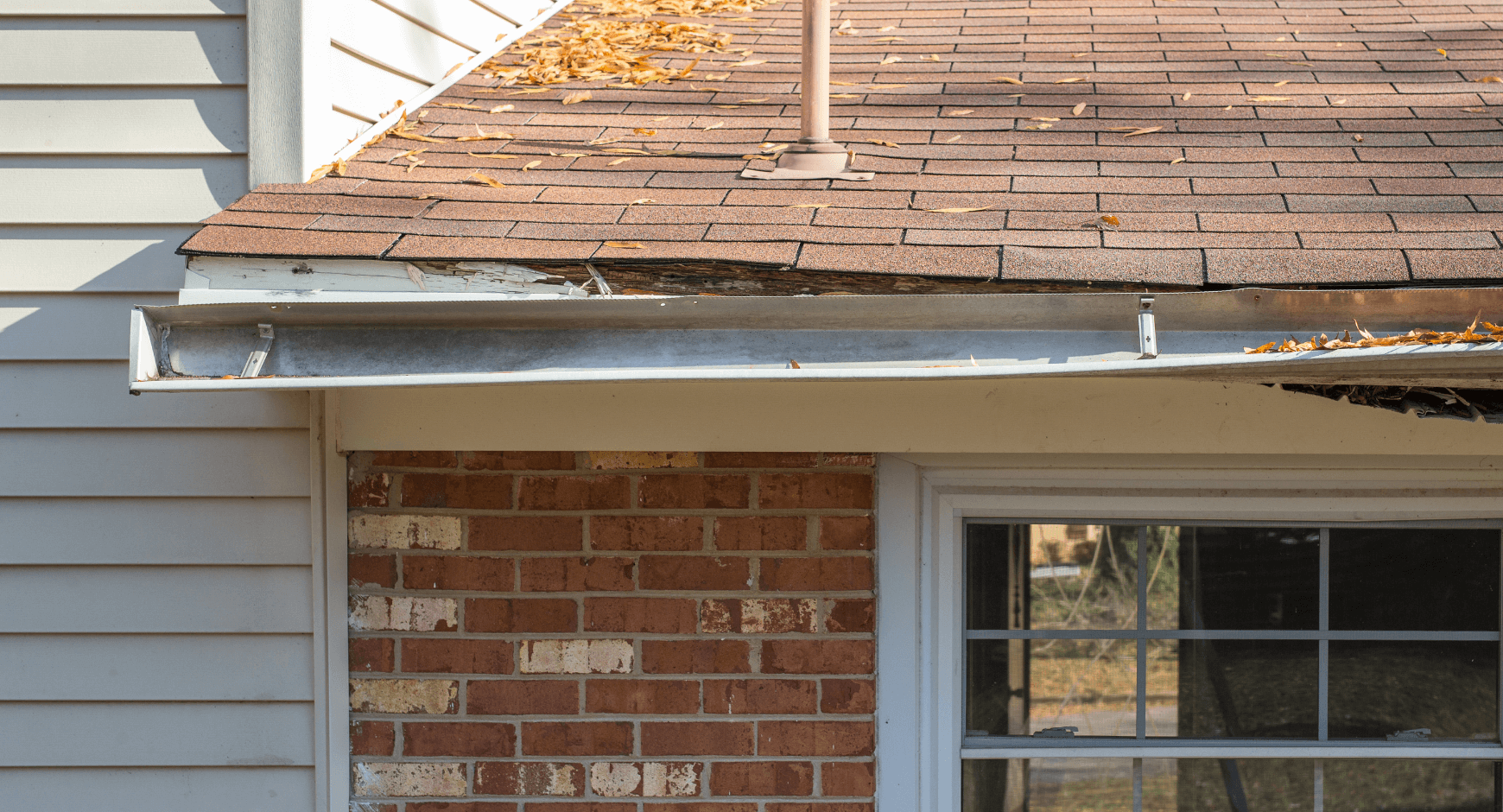 A house with a gutter on the side of it