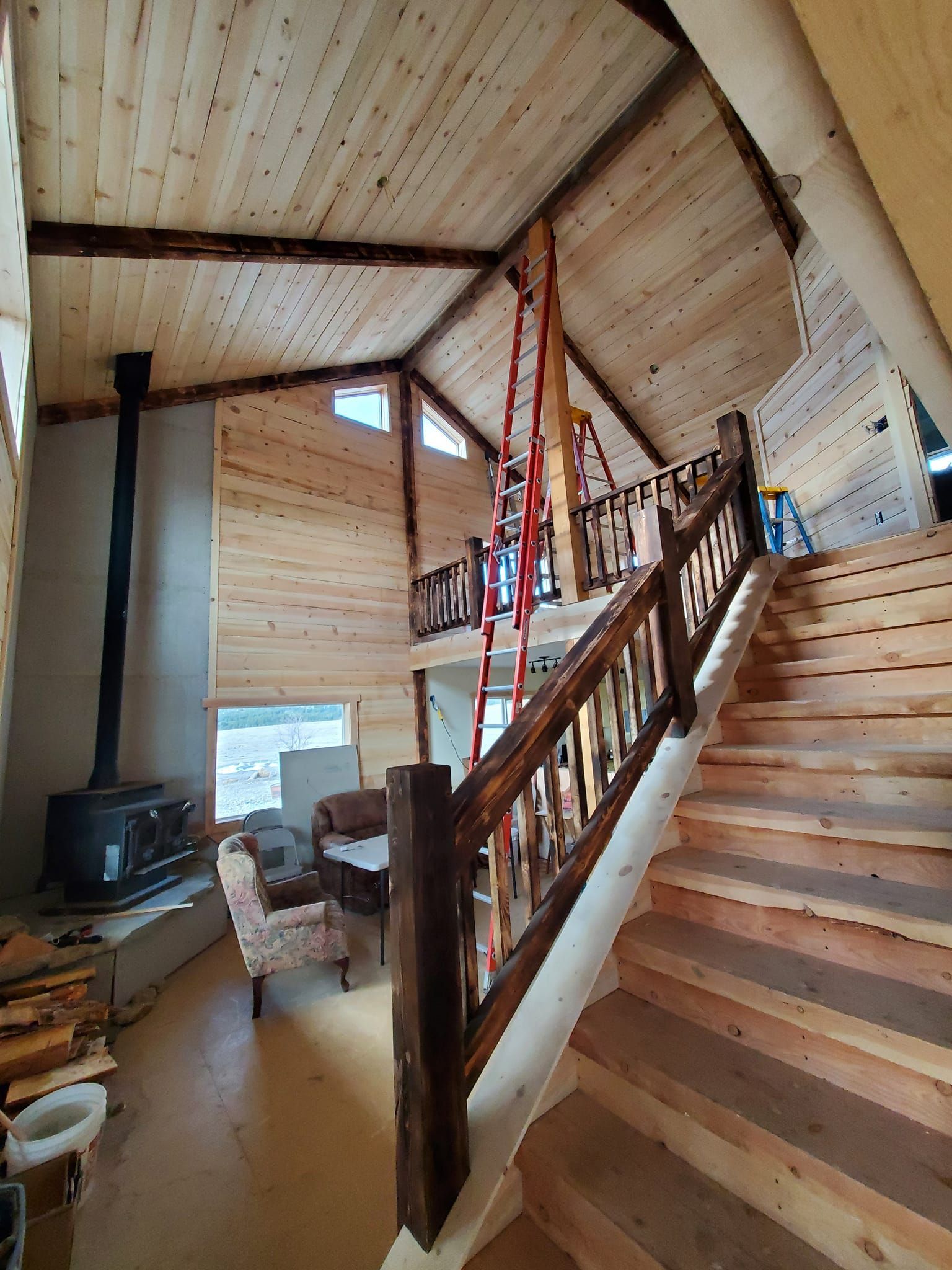 A wooden staircase leading up to the second floor of a house.