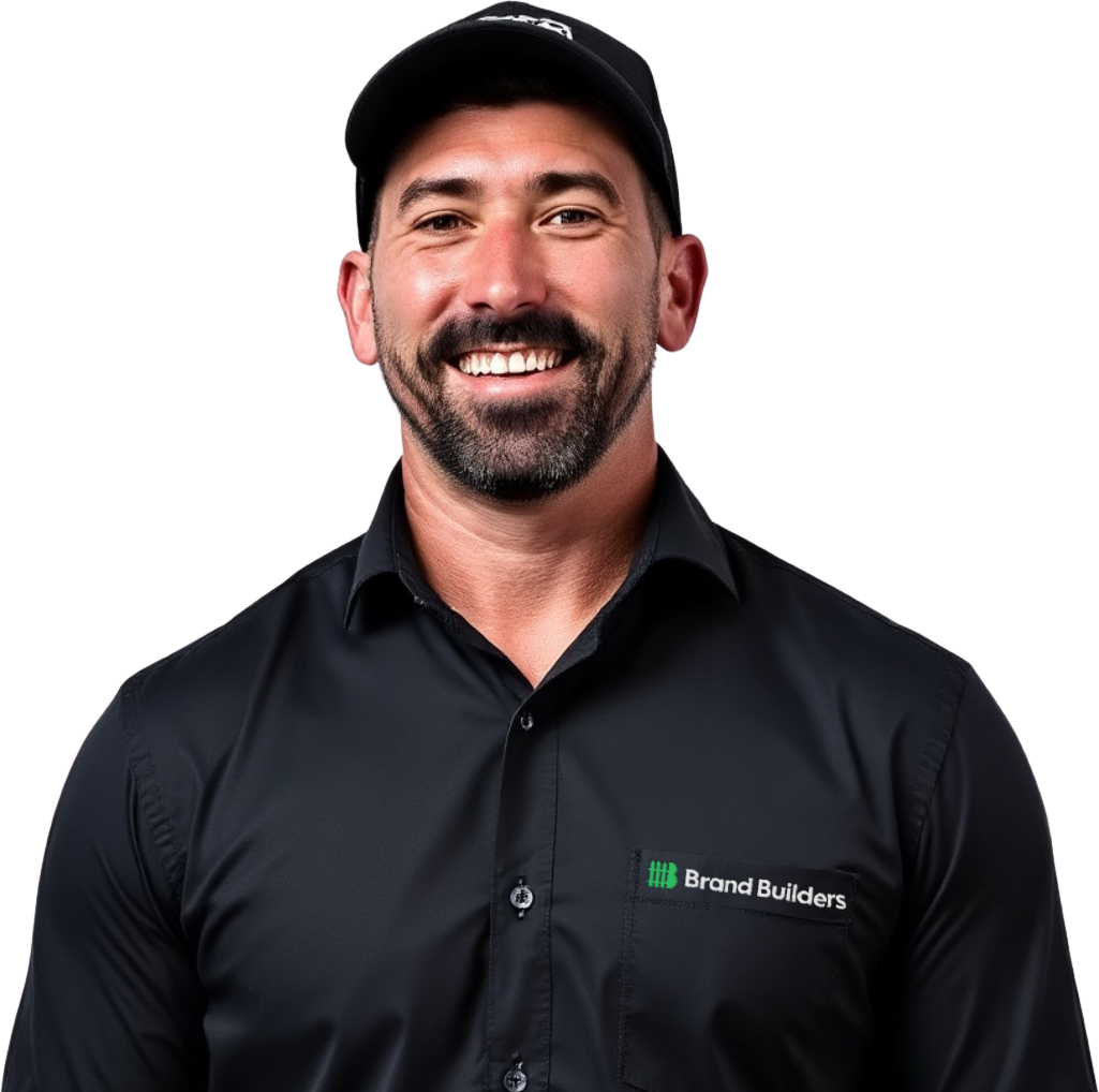 A man with a beard wearing a hat and a black shirt that says brandbuilders