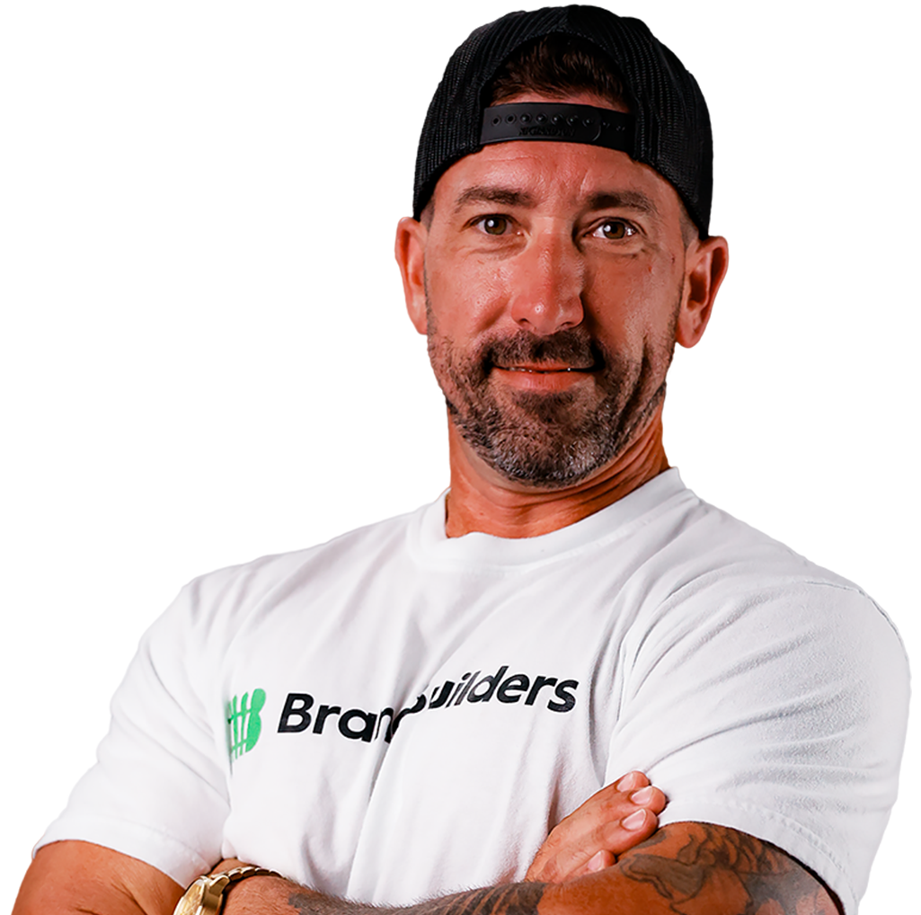 A man wearing a white shirt that says bray builders