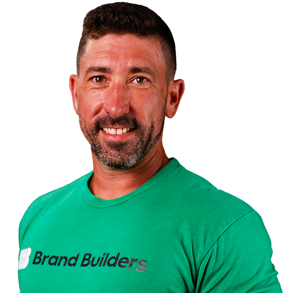 A man wearing a green shirt that says brand builders
