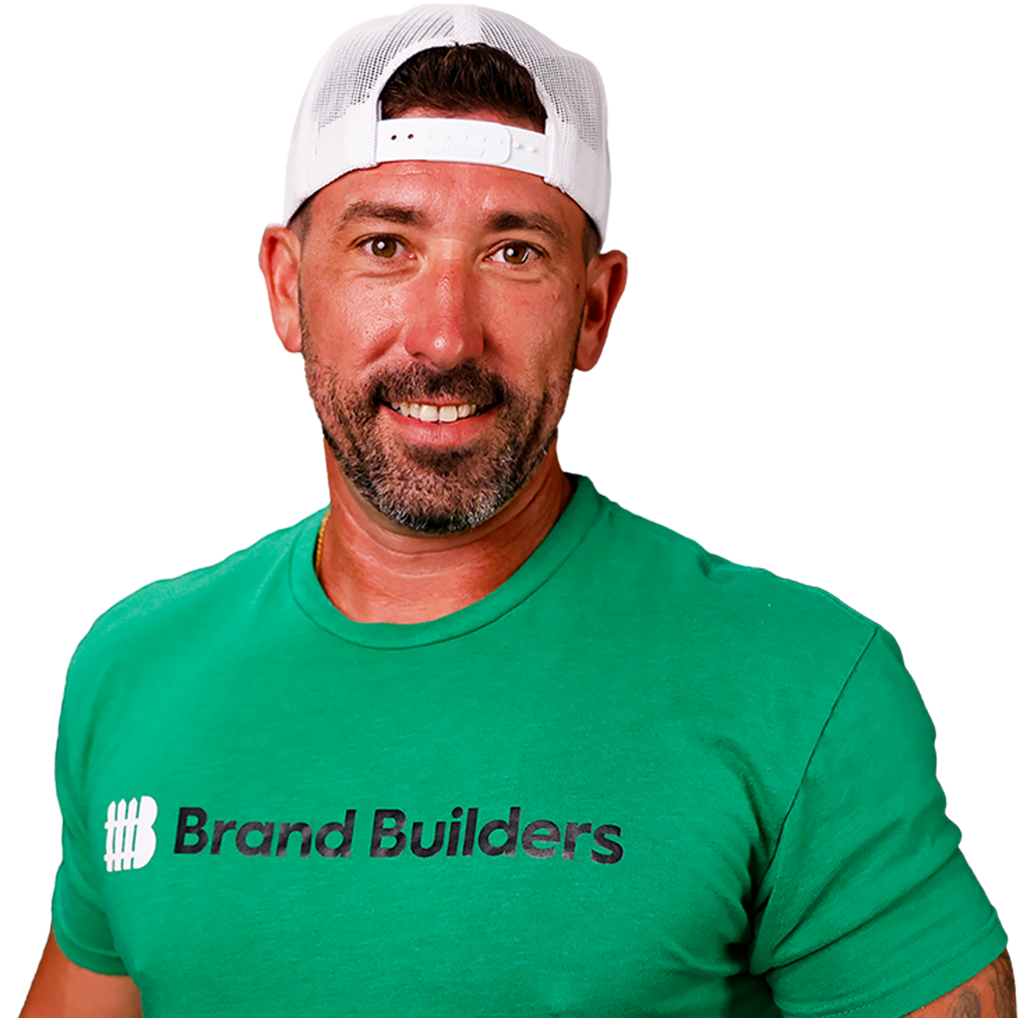 A man wearing a green shirt that says brand builders