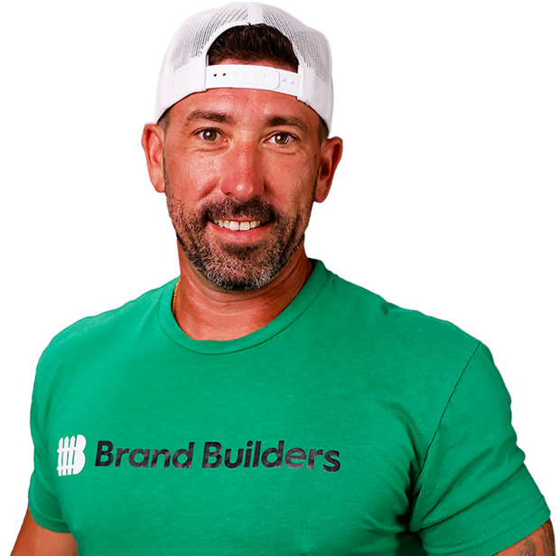 A man wearing a green shirt that says brand builders