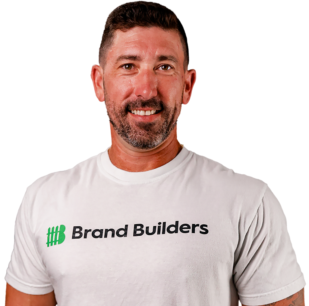 A man wearing a white shirt that says brand builders