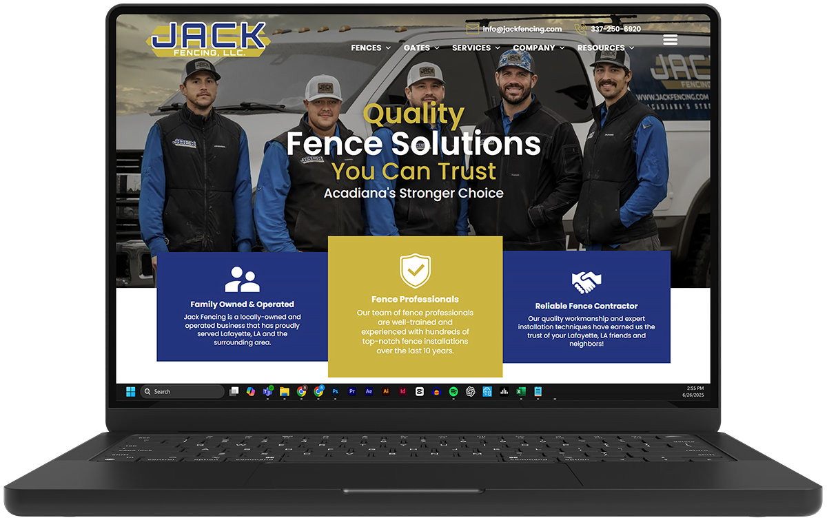 A laptop computer is open to a website for jack fence solutions.