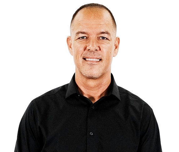 A man in a black shirt is smiling for the camera