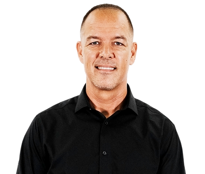 Portrait of a smiling person in a black shirt against a white background