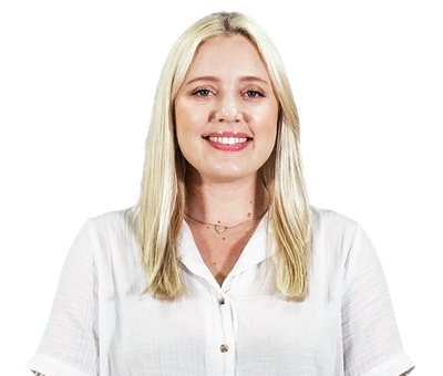 Smiling blonde woman in a white blouse against a white background