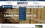 Liberty Fence & Deck Co. website homepage with blue navigation and a wooden fence hero image