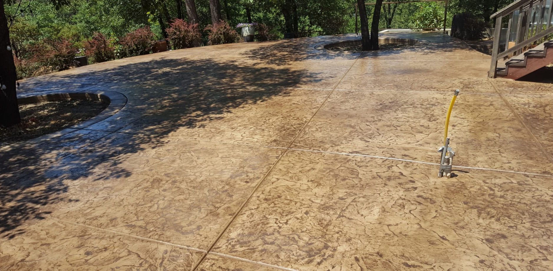 A wide decorative concrete patio.