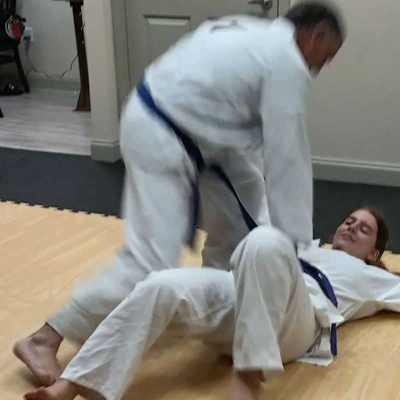 two people sparring in tang soo do martial arts