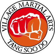 The logo for village martial arts tang soo do shows a fist in a circle.