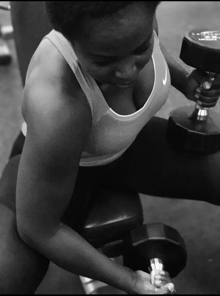 Woman lifting a dumbbell
