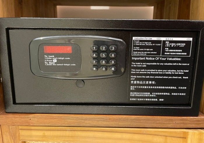 A black safe with a digital display on top of it