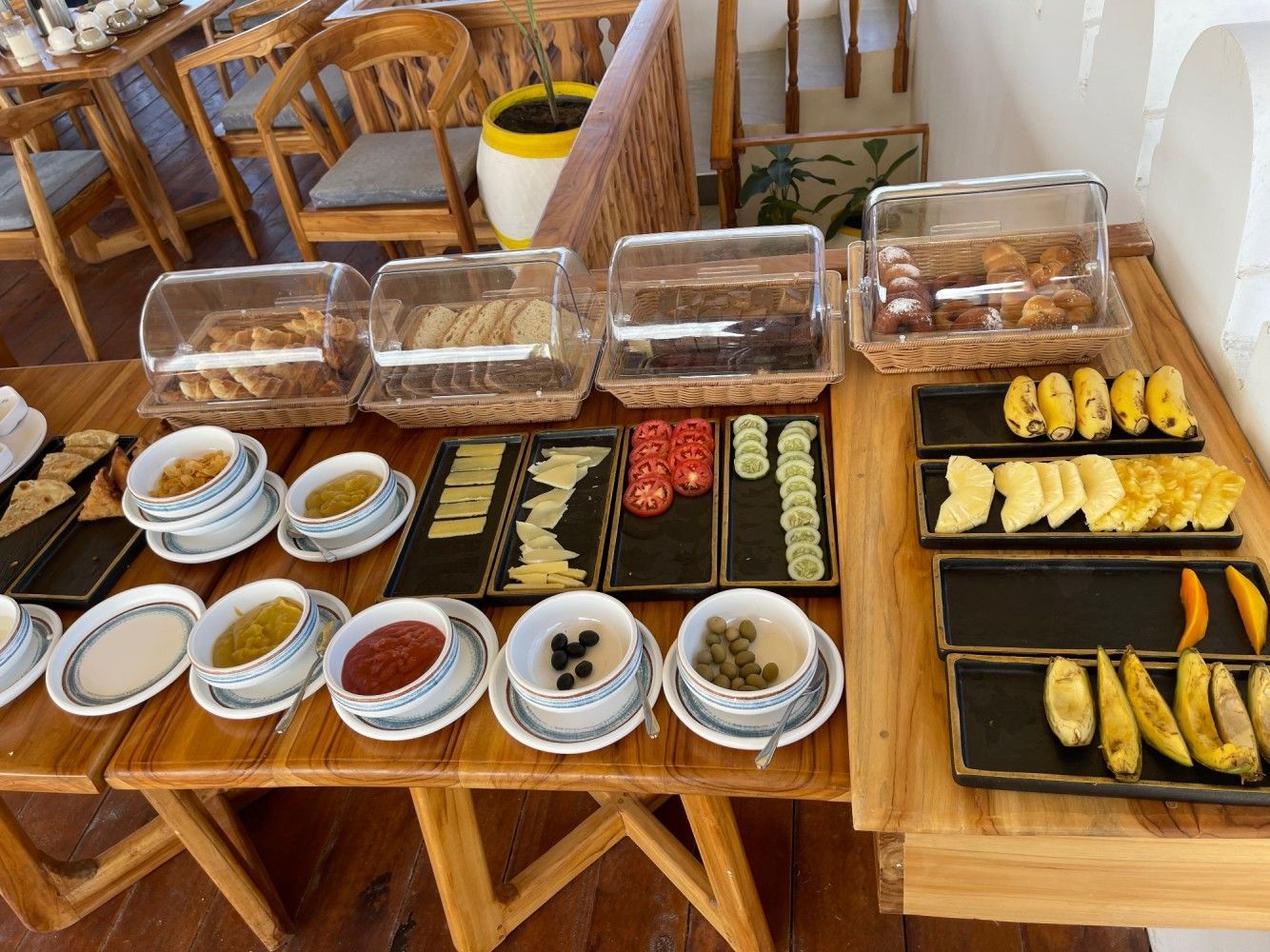 A buffet table with a variety of food on it