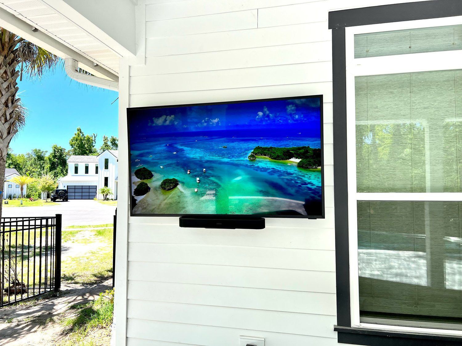 A Flat Screen TV Is Mounted On The Wall Of A House — Ponte Vedra Beach, FL — Wired Works LLC