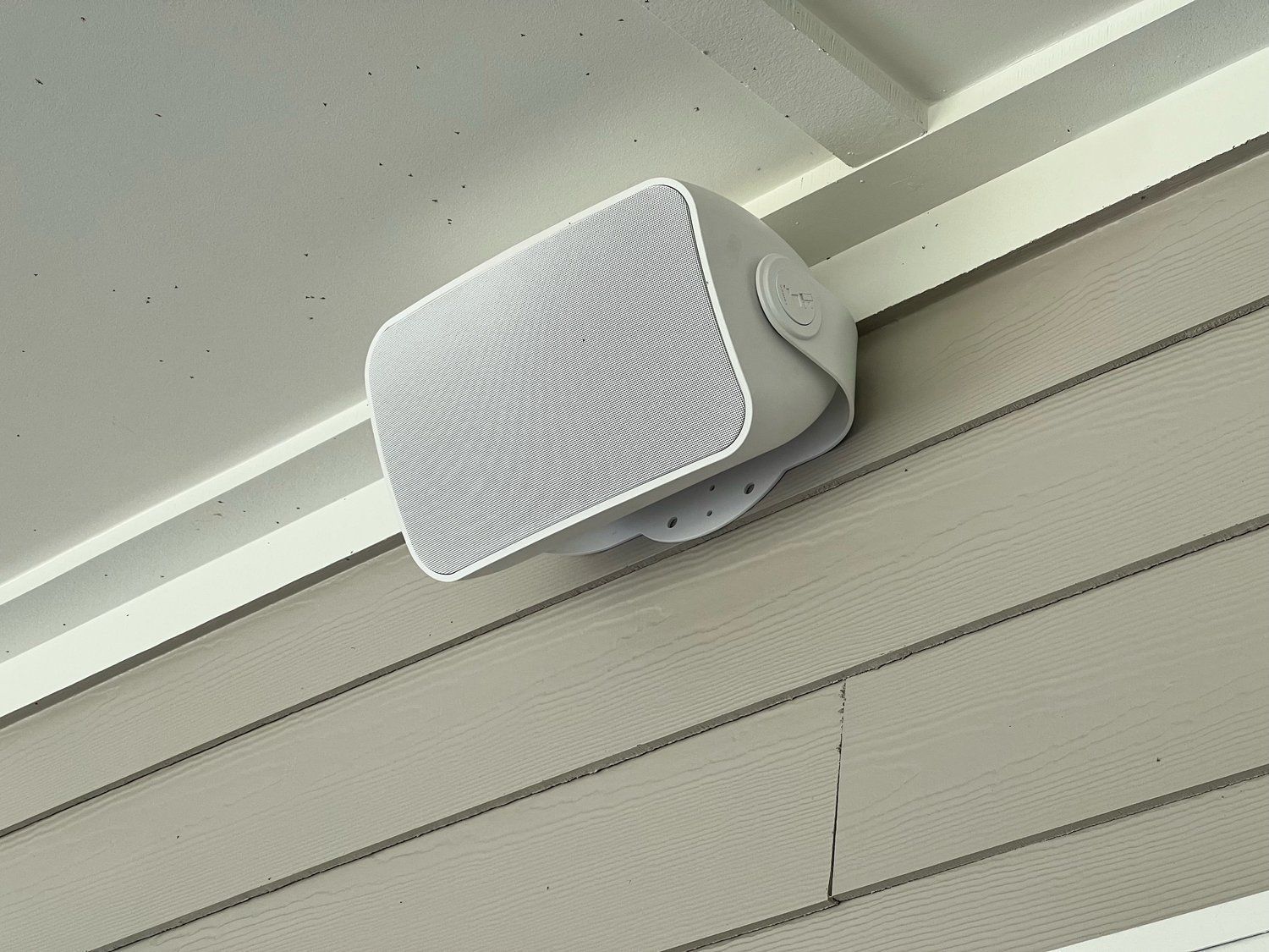 A White Speaker Is Mounted To The Side Of A Building — Ponte Vedra Beach, FL — Wired Works LLC
