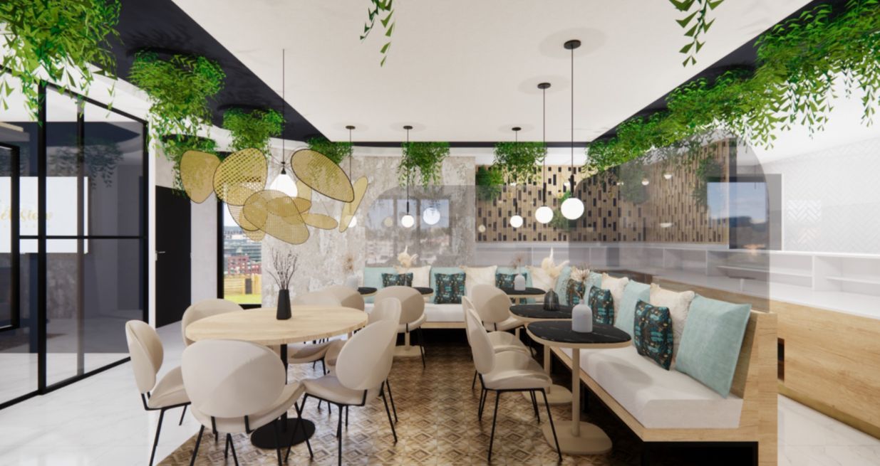 Intérieur d'un café avec tables et cabines, décoré de verdure et de tons neutres.